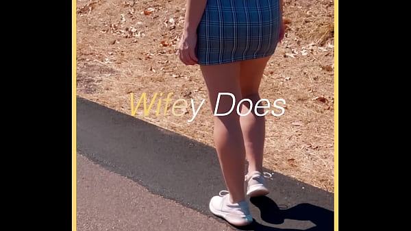 MILF shows her shaved pussy in public